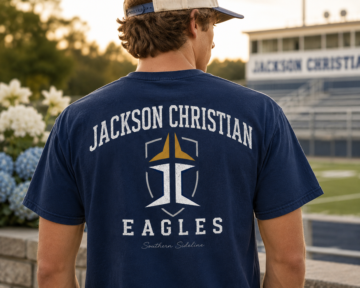 Jackson Christian Eagles crest logo on a navy cotton tee